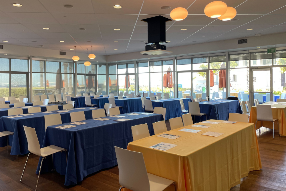 6 feet long tables and seats in Terrace Room on the morning of the Neurobehavioral Genetics Retreat hosted on May 12, 2022 at the Annenberg Community Beach House